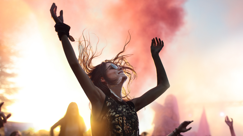 woman dancing surounded by smoke